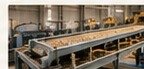 Cooling and screening finished biomass pellets